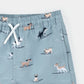 Surfing Pups Print on Blue Swim Trunks